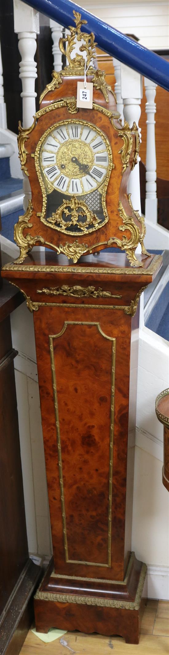 A Louis XV style burr walnut and gilt metal-mounted pedestal clock